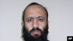 Hafiz Rashid, a senior leader of the al-Qaida-linked Haqqani network, poses for a picture in Kabul, Afghanistan, Oct. 15, 2014.