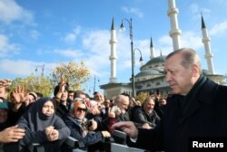 Turkish President Tayyip Erdogan greets his supporters after Friday prayers in Ankara, Nov. 24, 2017.