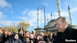 Turkish President Tayyip Erdogan greets his supporters after Friday prayers in Ankara, Nov. 24, 2017.