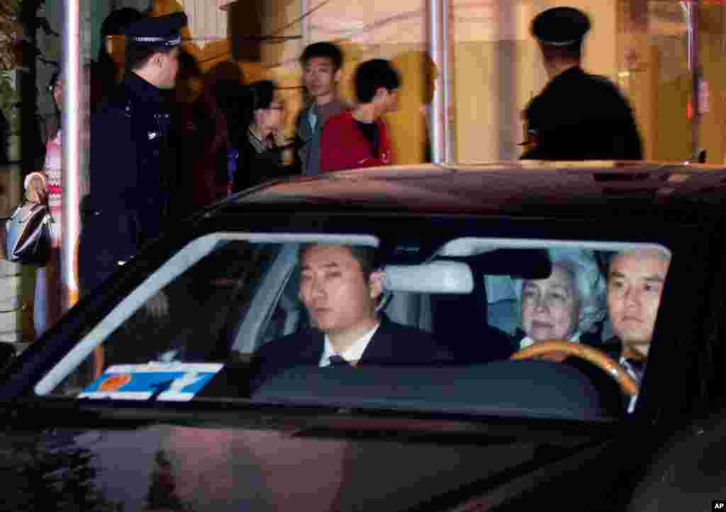 Monineath Sihanouk, wife of former Cambodian King Norodom Sihanouk, sits on the backseat of a car upon arrival at a hospital where the king received treatment, in Beijing, China, October 15, 2012.