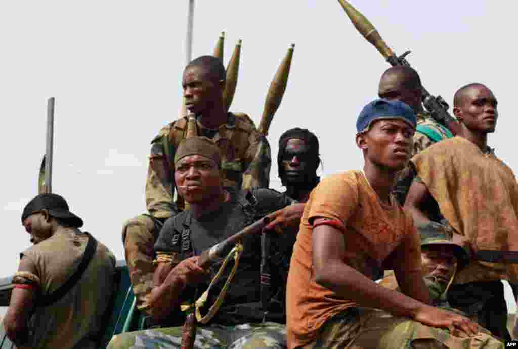 April 6: Soldiers loyal to Ouattara prepare to deploy at one of the principal entrances to Abidjan, Ivory Coast. (AP Photo/Rebecca Blackwell)