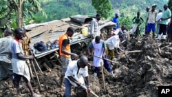 Residents of Mbale in eastern Uganda search for bodies in the debris of a 03 Mar 2010 landslide triggered by torrential rain