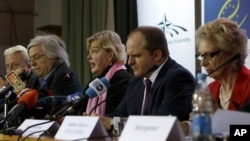 OSCE election observation mission special coordinator Walburga Habsburg Douglas, center, speaks to the media during a news conference in Kiev, Ukraine, Monday, Oct. 29, 2012. 