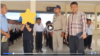 A photo from a video posted by Kampot police officials on Wednesday making an underage student publicly apologize for allegedly spreading fake news in a private Facebook audio message. (Photo from Facebook page of Kampot police officials) 