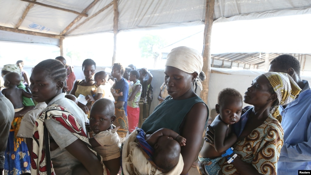 FILE - Women who fled fighting in South Sudan wait with their children for the immunization of their children on arrival at Bidi Bidi refugee’s resettlement camp near the border with South Sudan, in northern Uganda, Dec. 7, 2016.
