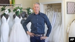David Gaffke, owner of the bridal salon Complete Bridal, poses in his shop in East Dundee, Illinois, on Feb. 28, 2020. He is heavily reliant on China for manufacturing. 