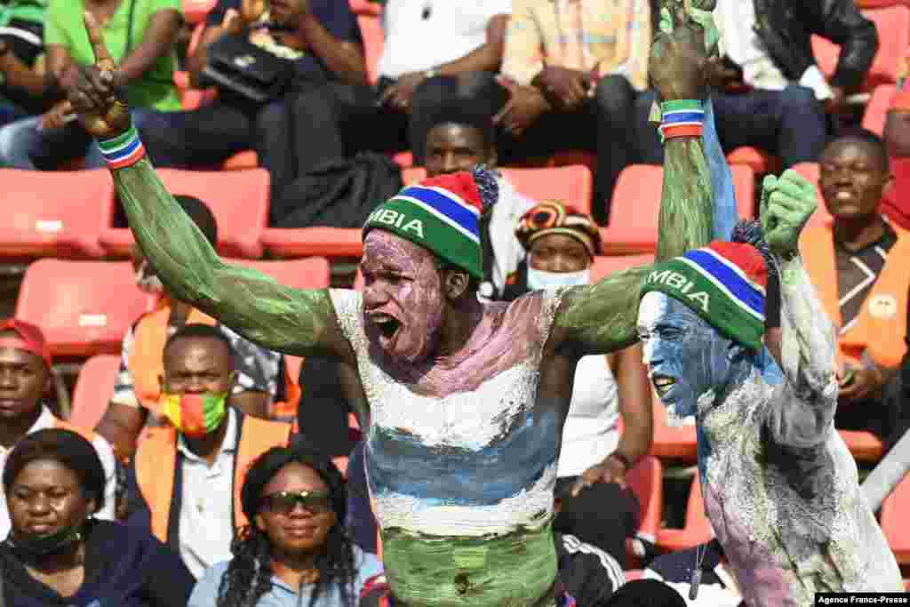Gambia supporters cheer during the Africa Cup of Nations (CAN) 2021 round of 16 football match between Guinea and Gambia at Stade de Kouekong in Bafoussam, Cameroon.