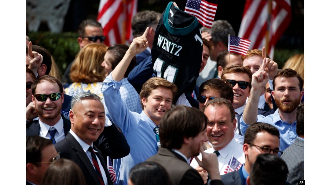 An Philadelphia Eagles fan carries the jersey of quarterback Carson Wentz during a "celebration of the American flag" event at the White House in Washington, June 5, 2018.