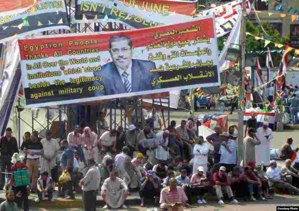Pro-Morsi supporters in Muslim Brotherhood rallying point outside Rabaa al-Adawiya mosque in Cairo, July 11. Photo: VOA/Sharon Behn