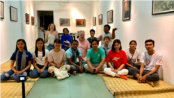 Srey Bandaul seen here with a group of artists and professionals at an exhibition in Phnom Penh. (Courtesy of Phare Ponleu Selapak)