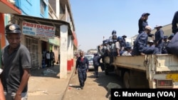 Zimbabwe police was in streets of Harare on Sept. 16, 2018 removing vendors as part of efforts to fight cholera outbreak which has killed more than two dozen people over the past two weeks. 