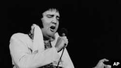 FILE - In this May 23, 1977 file photo, Elvis Presley performs in Providence, R.I., three months before his death.