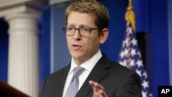 White House press secretary Jay Carney gestures while talking about problems with the Obamacare website during his daily news briefing at the White House in Washington, Oct. 23, 2013.