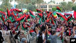 Libyans celebrate the liberation of Libya at Martyrs' Square in Tripoli, Libya, October 23, 2011.