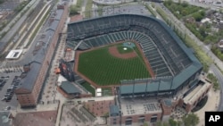 In this aerial photo, Oriole Park at Camden Yards sits empty in Baltimore, as unrest that occurred after Freddie Gray's funeral continues into a second day, April 28, 2015.