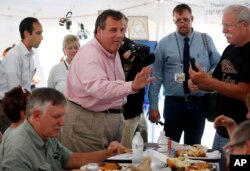 FILE - New Jersey Governor Chris Christie, one of 17 Republican presidential candidates, campaigns during a stop at a Greek festival in Manchester, N.H., Aug. 29, 2015.