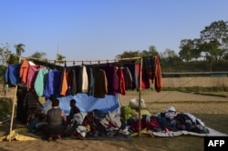 A Rohingya Muslim refugee sells winter clothes at Balukhali refugee camp in Bangladesh's Ukhia district on January 24, 2018. (AFP Photo)