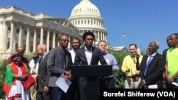 Feyisa Lelisa makes remarks in Washington, D.C., in September, 2016. The Olympic silver medalist from Ethiopia challenged Congress to recognize more freedoms are possible in his home country.