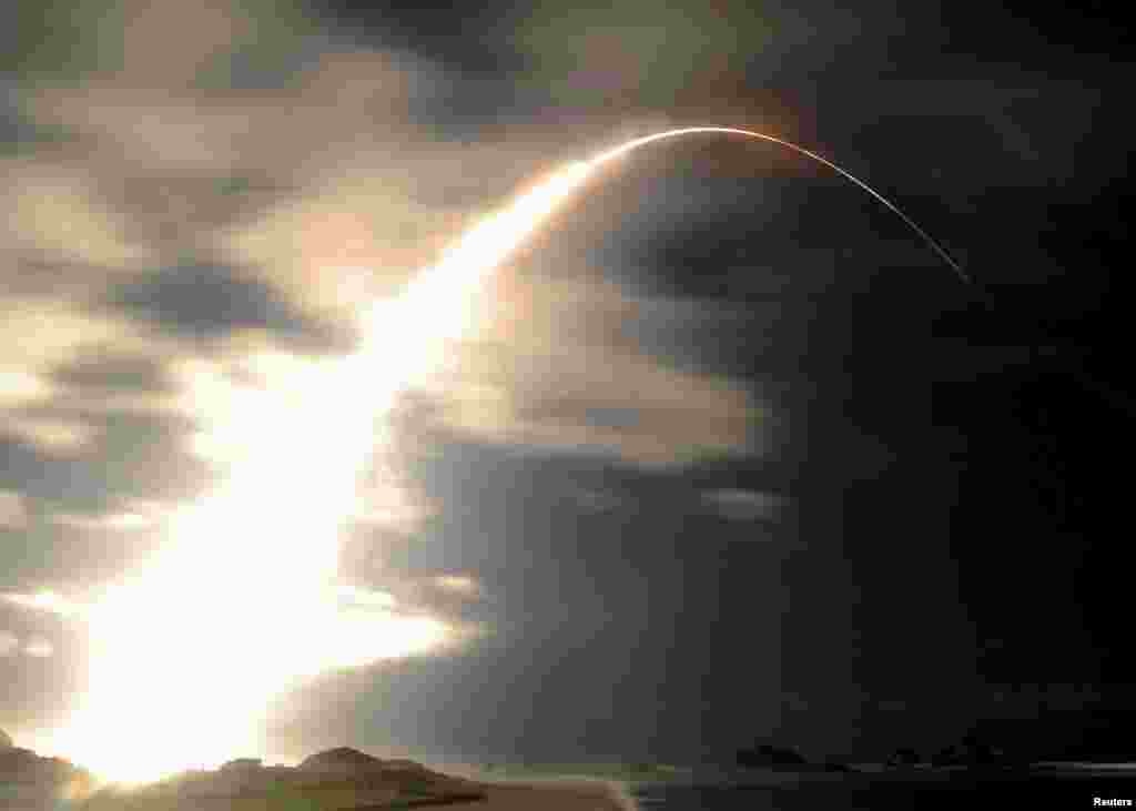 A H-2B rocket carrying cargo for the International Space Station (ISS) called Kounotori No.5 blasts off from the launching pad at Tanegashima Space Center on the Japanese southwestern island of Tanegashima, Kagoshima prefecture, southwestern Japan in this photo taken by Kyodo.