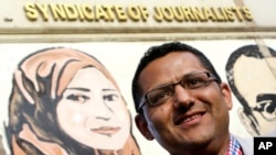 FILE - Khaled El-Balshy, Head of Journalists Syndicate's Freedoms Committee, poses for a photograph in Cairo, Egypt. 