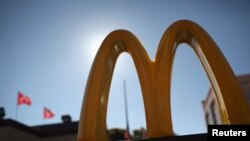 FILE - The McDonald's logo is seen outside a restaurant in San Francisco.