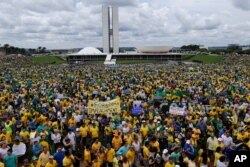 FILE - Thousands of demonstrators take part in a protest against the government of Brazil's President Dilma Rousseff, in front of the Brazilian National Congress, in Brasilia, Brazil, Sunday, March 15, 2015.
