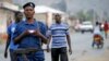 FILE - Burundi police patrol the streets of Musaga district in the capital, Bujumbura, after the results of the presidential elections were released, July 24, 2015.