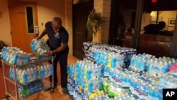 Water is donated to Flint, Michigan, for residents unable to drink water from their pipes.