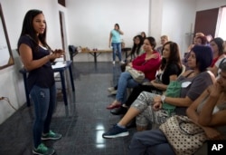 Marialbert Barrios speaks to a group of women at an empowerment workshop, in the Catia neighborhood of Caracas, Venezuela, Aug. 26, 2018.