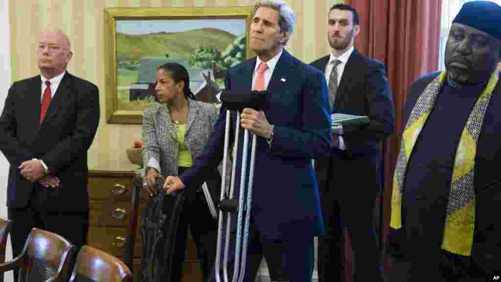 Le Secrétaire d'Etat américain, John Kerry, Susan Rice, conseillère présidentielle sur la sécurité nationale et Rochas Okorocha, gouverneur de l'État d'Imo, lors de l'entretien dans le bureau ovale entre les présidents américain et nigérian. Washington, 20 juillet 