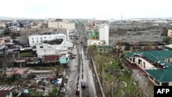 An aerial view shows destroyed buildings with ripped off roofs after super Typhoon Goni hit the town of Tabaco, Albay province, south of Manila on November 1, 2020. (Photo by Charism SAYAT / AFP) 