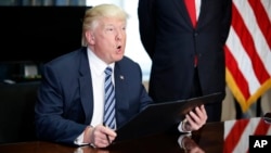 President Donald Trump speaks before signing an executive order at the Treasury Department in Washington, April 21, 2017.