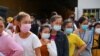 Garment factory workers and staff wait to receive China's Sinovac coronavirus disease (COVID-19) vaccine at an industrial park in Phnom Penh, Cambodia, April 7, 2021. REUTERS/Cindy Liu