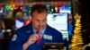 FILE - Gerard Farco follows stock prices at the New York Stock Exchange in New York, Dec. 21, 2016. 