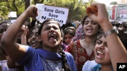 Indian students shout slogans during a protest rally in Hyderabad, India, December 31, 2012. 