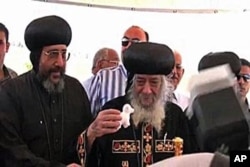 Pope Shenouda III, head of the Orthodox Coptic Christian Church, places a little toy lamb - the orphanage’s mascot - in the building's cornerstone at the 2009 groundbreaking.