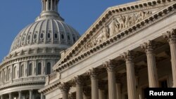 FILE - The dome of the U.S. Capitol building, left, is pictured in Washington, D.C., Oct. 4, 2013. 