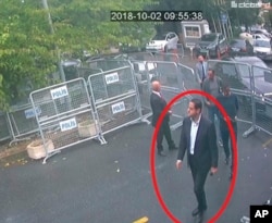 In a frame from surveillance camera footage taken Oct. 2, 2018, and published Oct. 18, 2018, by Turkish newspaper Sabah, a man identified by Turkish officials as Maher Abdulaziz Mutreb, walks toward the Saudi consulate in Istanbul before journalist Jamal Khashoggi disappeared.