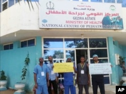 FILE - This handout image provided by a Sudanese activist, shows doctors on strike at a hospital in al-Jazirah, Sudan, Dec. 24, 2018.