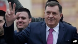 Milorad Dodik, president of the Republika Srpska, gestures moments before a parade marking 26th anniversary of the republic in the Bosnian town of Banja Luka, Jan. 9, 2018.