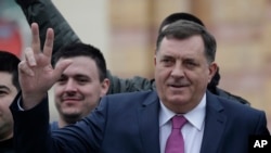 Milorad Dodik, President of the Republika Srpska gestures moments before a parade marking 26th anniversary of the republic in the Bosnian town of Banja Luka, Jan. 9, 2018.