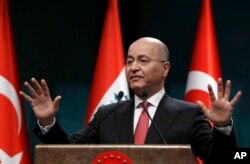 Iraq's President Barham Salih speaks to the media during a joint news conference with Turkey's President Recep Tayyip Erdogan, in Ankara, Turkey, Jan. 3, 2019.