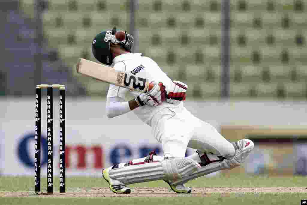 Bangladesh’s Nasir Hossain avoids a bouncer on the second day of the second cricket test match against New Zealand in Dhaka, Bangladesh.