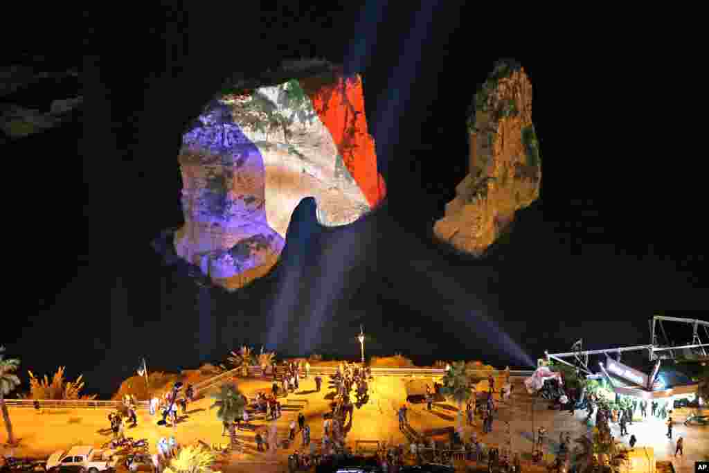 The landmark Raouche sea rock&nbsp;in Beirut, Lebanon, is illuminated in the colors of the French flag to show solidarity with France after the attacks in Paris.