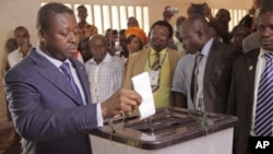 FILE - Togo President Faure Gnassingbe casts his ballot in Lome during legislative elections July 25, 2013.