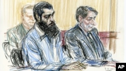In this courtroom drawing, Abid Naseer, front left, sits next to his court-appointed legal adviser, James Neuman, as they listen to the guilty verdict against Naseer in federal court in Brooklyn, New York, March 4, 2015.