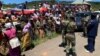 People in Chimanimani complain, March 22, 2019, to senior army officials in charge of a temporary camp set up after Cyclone Idai that food is not reaching them.
