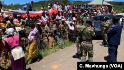 People in Chimanimani complain, March 22, 2019, to senior army officials in charge of a temporary camp set up after Cyclone Idai that food is not reaching them.