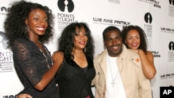 FILE - Joni Sledge (second from left) with Rodney Jerkins, her niece Camille Sledge (left) and her cousin Amber Sledge. Sledge, who with her sisters formed Sister Sledge and recorded the defining dance anthem "We Are Family," has died, the band's representative said.