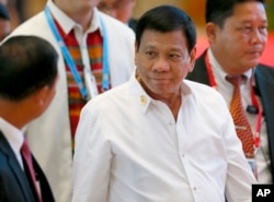 FILE - Philippine President Rodrigo Duterte arrives at the National Convention Center for scheduled bilateral meetings with ASEAN leaders on the sidelines of the 28th and 29th ASEAN Summits and other related summits Tuesday, Sept. 6, 2016.